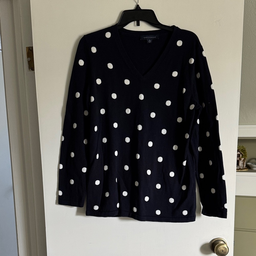 Navy blue polka dot sweater.
